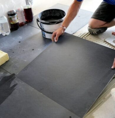 5 Of The Best Materials For Basement Flooring 2 A picture of a man choosing the best materials for his basement flooring project