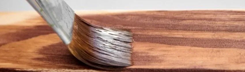 A photo depicting how to apply acrylic paint on wood.