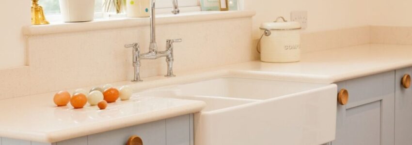 A beautiful farmhouse sink in a white kitchen.