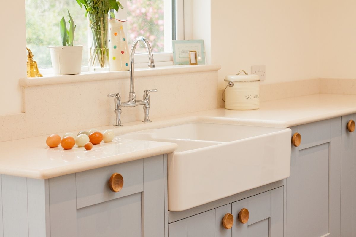 A beautiful farmhouse sink in a white kitchen.