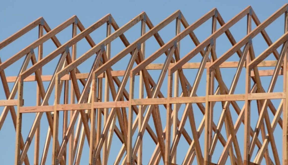 A row of roof trusses on an unfinished house.