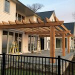 Pergolas Trellis installed on the porch of a residential home.
