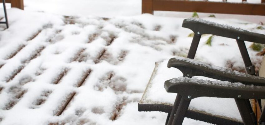 A snow-filled wood deck.