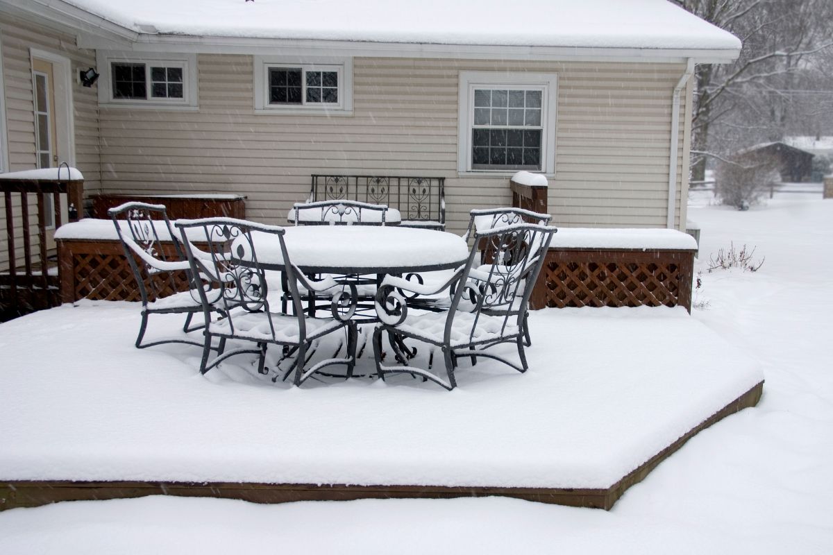 A homeowner plans to use ice melt for a snow-filled wood deck.