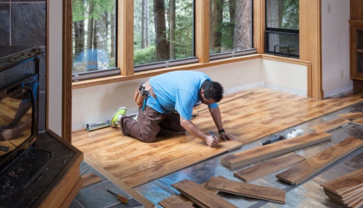 a man choosing the best wood filler for floors