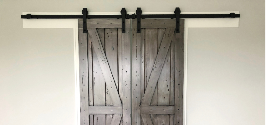 A barn door made from reclaimed woods.