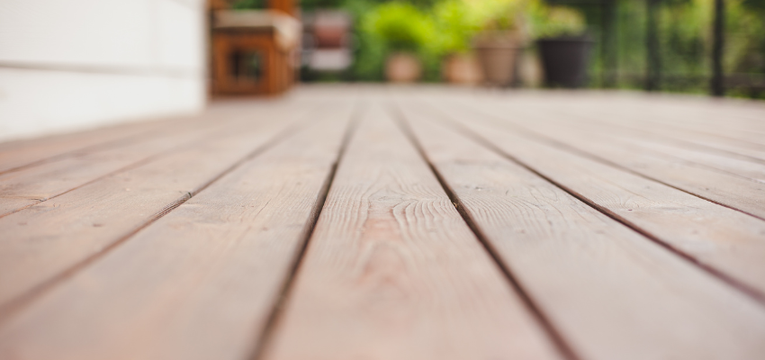 A close up of a wooden deck floor.