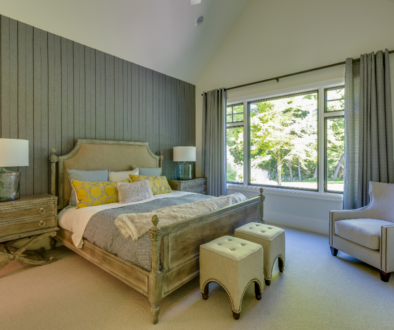 A bedroom with a wood accent wall design.