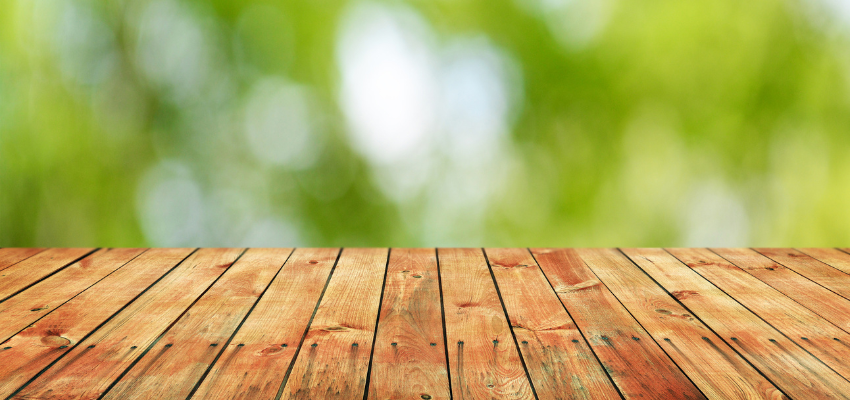 A wooden table with deep scratches was fixed using wood fillers.