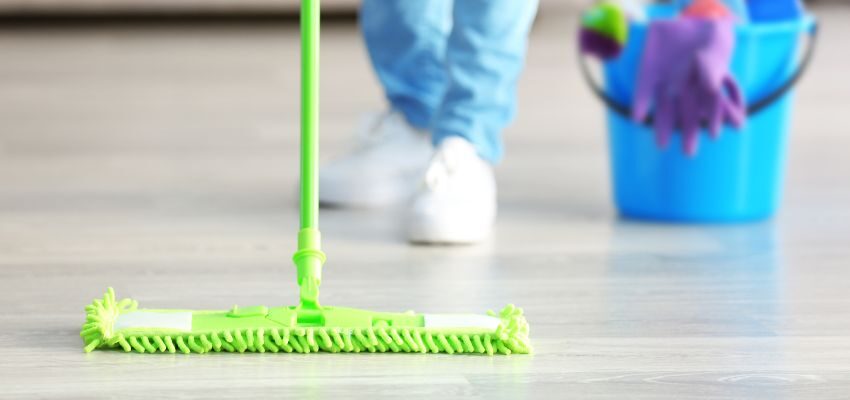 wood floor cleaner that shines homemade (3) The person is cleaning the floor.