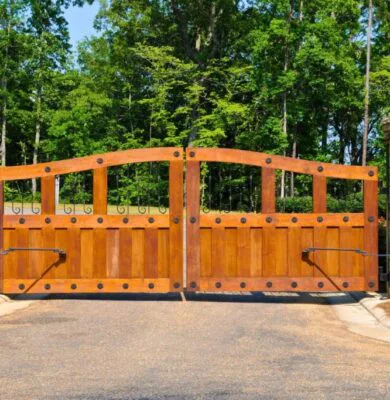 A wood fence gate brings timeless charm.