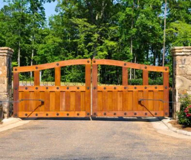 A wood fence gate brings timeless charm.