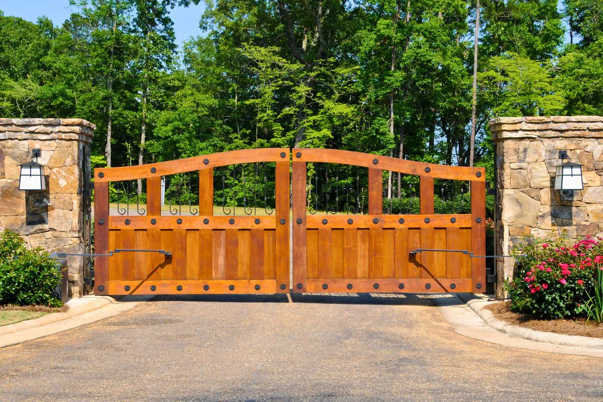A wood fence gate brings timeless charm.