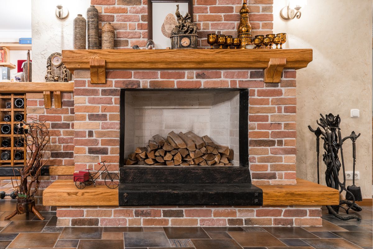 A home that installs a wood mantel for a brick fireplace.