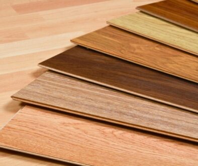 Collection of various wood floor colors displayed as planks, ranging from light beige to rich dark brown tones for interior design selection
