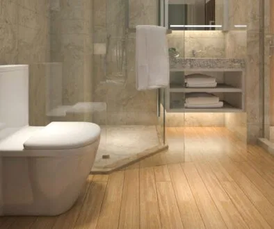 The bathroom has wood floors.