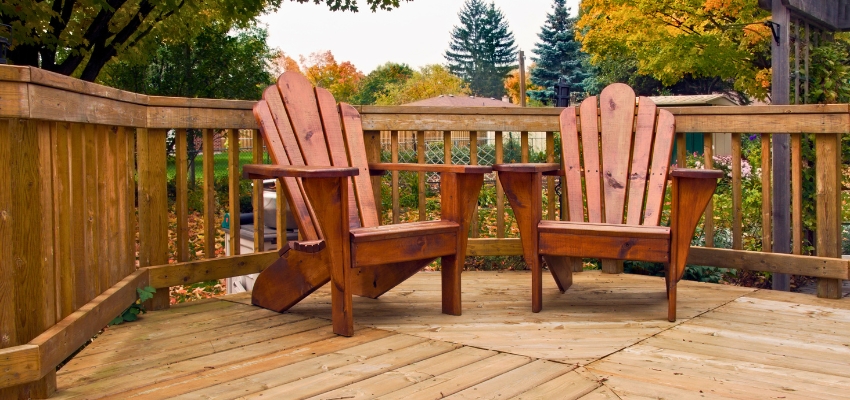 Outdoor deck with Adirondack chairs built from water resistant wood for lasting weather protection