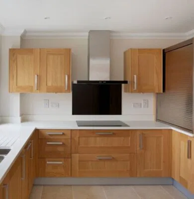 The oak kitchen cabinets look modern.