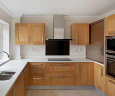 The oak kitchen cabinets look modern.