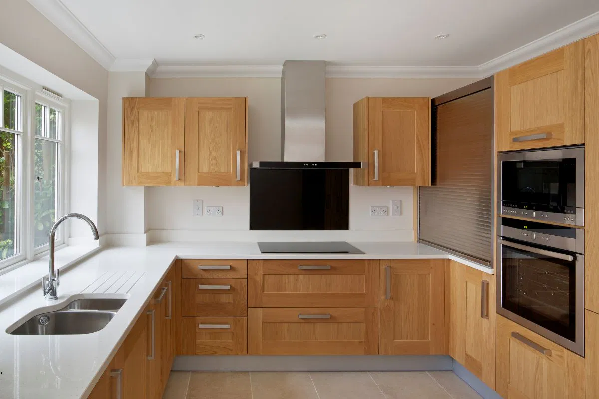 The oak kitchen cabinets look modern.