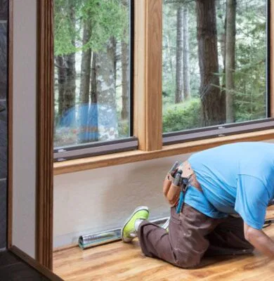 The man is fixing the hardwood floor.