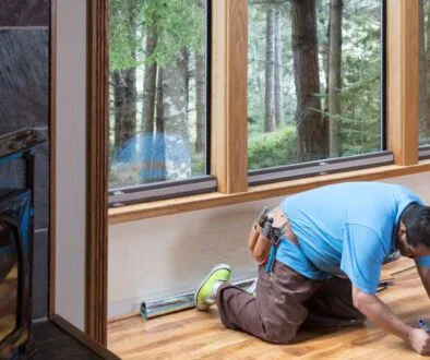 The man is fixing the hardwood floor.