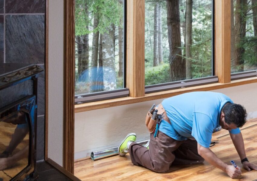 The man is fixing the hardwood floor.