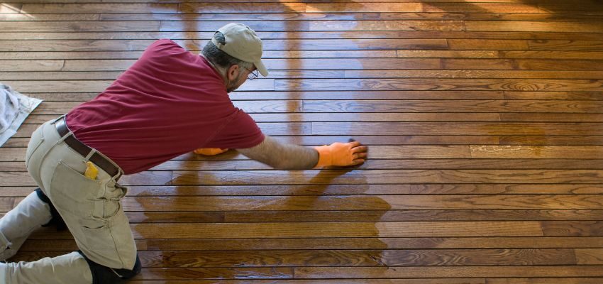 Refinishing is the best option for hardwood floors with widespread wear, fading, or surface damage.