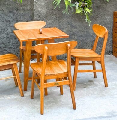 Stylish wooden dining set highlighting the pros and cons of rubberwood for furniture in everyday use.