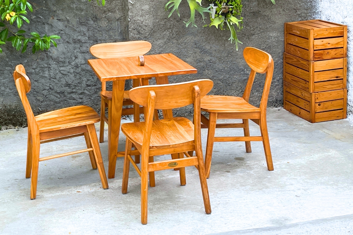 Stylish wooden dining set highlighting the pros and cons of rubberwood for furniture in everyday use.