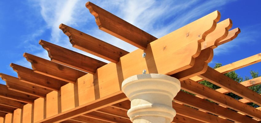 A close up view of a pergola's material, a perfect example of what a pergola is used for to enhance garden aesthetics.