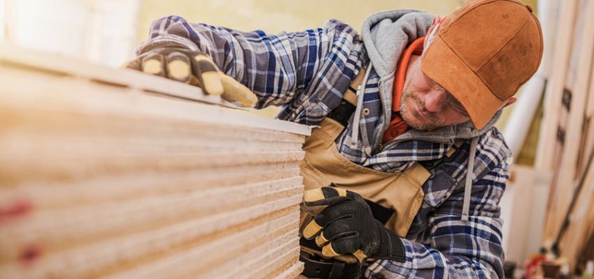 The woodworker looks at what type of plywood suits his needs.