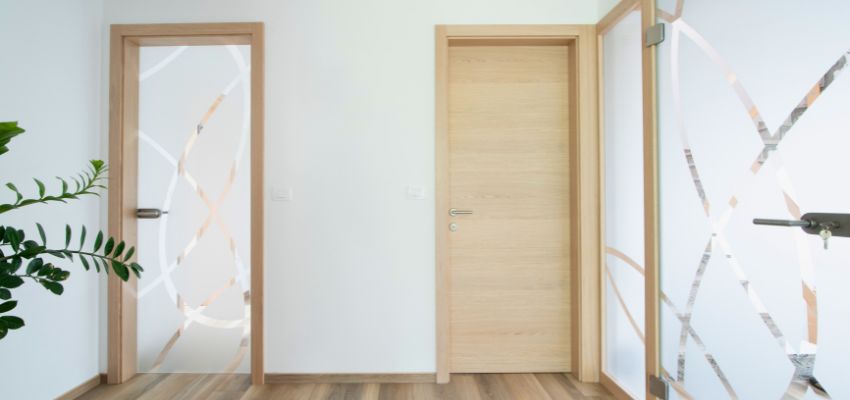 Minimalist modern interior door in a hallway representing the best interior doors for small spaces.