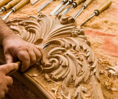 A skilled carver is very detailed in the finishing of his wooden project.